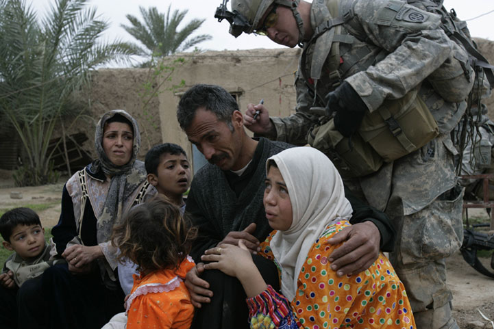 US forces mark Iraqis with serial numbers to track movement of population in and out of a village. Iraq 2007.